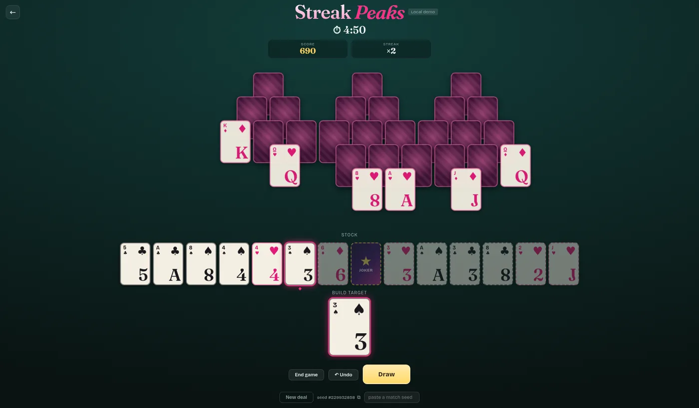 A Streak Peaks board: three overlapping peaks of face-down cards above a row of face-up ones.